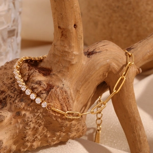 Detail of 18K gold-plated chain bracelet with zircon stones and paperclip links