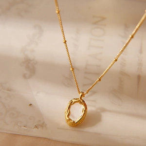 Vintage 18K gold plated necklace with oval shell pendant and organic textured frame