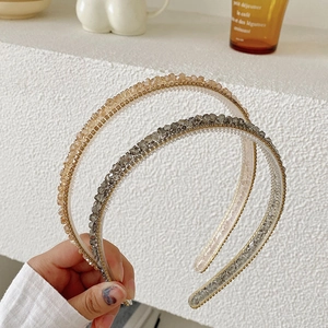Sparkling crystal rhinestone headbands set in champagne gold and smoky grey colors