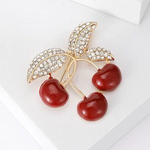 Sparkling cherry brooch with red enamel fruits and crystal studded golden leaves