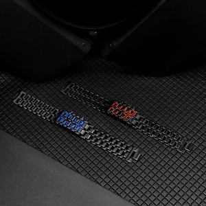 Detail view of black steel lava watches showing red and blue LED digital display screens