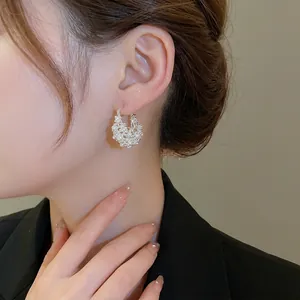 Elegant U-shaped hoop earrings with cluster white pearls and silver metal base