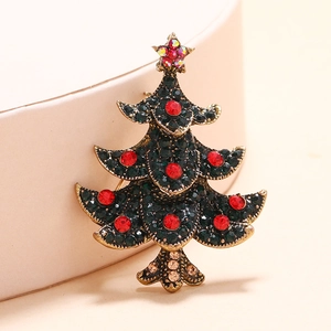 Vintage gold Christmas tree brooch with green and red rhinestones for festive attire