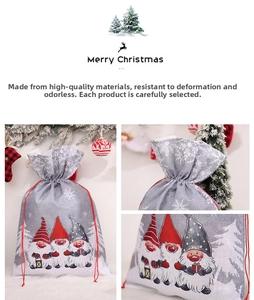 Close-up of Christmas drawstring gift bags with gnome prints and red cord closure