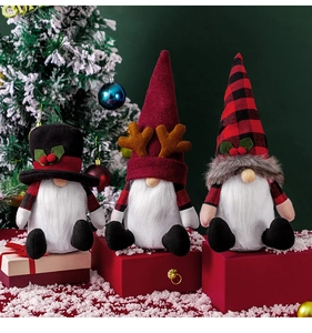 Close-up of three festive Christmas gnomes with plush textures and holiday decor details