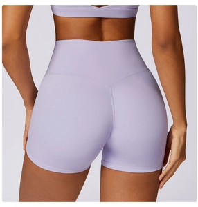 Detail view of high-waist lavender yoga shorts with V-shaped seam for lifting effect