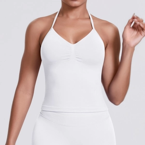 Detail of white halter neck sports bra with high-elastic fabric and pleated V-neckline