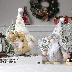 Handmade Christmas gnomes with gold and grey hats featuring snowflakes and reindeer patterns