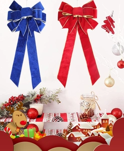 Detailed view of large red and blue velvet Christmas bows with gold wire edges