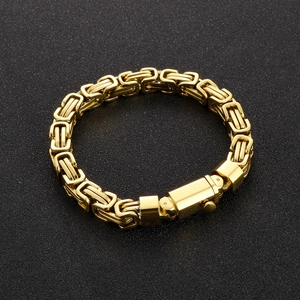 Macro detail of golden stainless steel Byzantine chain with secure box clasp closure