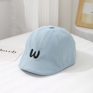 Detailed view of the light blue baby visor cap with black embroidered W letter logo