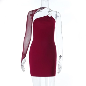 Close-up of wine red dress with sheer mesh sleeve and metallic ring detail
