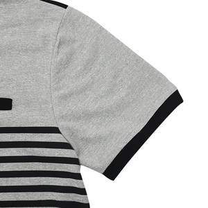 Close-up of grey and black striped cotton knit polo shirt showing hemmed cuff detail