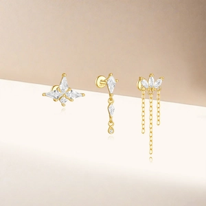 Détails de trois boucles d'oreilles en argent S925 doré avec étoile et pampilles