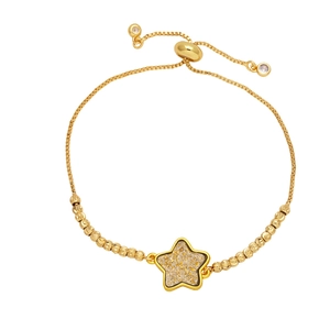 Adjustable gold star charm bracelet with sparkling inlay and zirconia details on white background