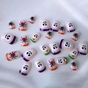 Short square Halloween press-on nails with purple orange tips and ghost spider patterns