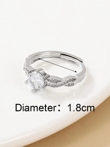 Detail of 1.8cm diameter adjustable silver crown ring with cubic zirconia and twisted band