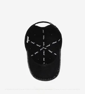 Detail view of washed cotton baseball cap inner lining with FBXS tape and adjustable strap