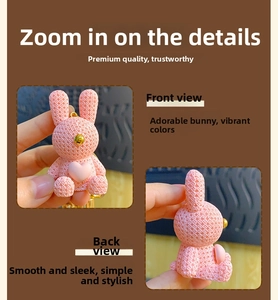 Detailed front and back views of a pink resin rabbit keychain with woven texture