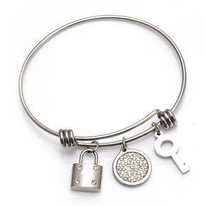 Adjustable stainless steel wire bangle with crystal lock, key and round disc charms