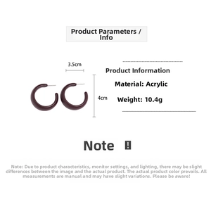 Detail view of acrylic C-shaped hoop earrings in deep red, size 4cm x 3.5cm, weight 10.4g