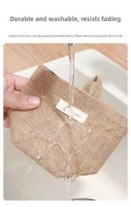 Hanging linen storage bag, durable washable fabric wall organizer for dorm room and home use.