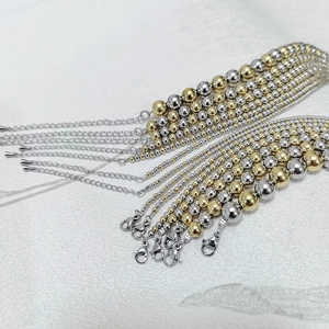 Detail of gradient stainless steel bead necklaces with lobster clasp and extension chain