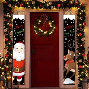 Close-up of Merry Christmas and Happy New Year door banners with Santa and reindeer motifs