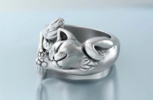 Detailed macro view of an adjustable cat ring with intricate silver-toned fur texture