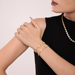 18K gold plated stainless steel bracelet with rectangular zircon inlay on female wrist