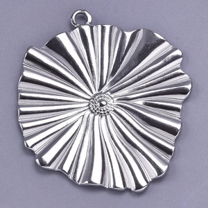 Macro detail of a 304 stainless steel irregular floral pendant with a polished silver finish