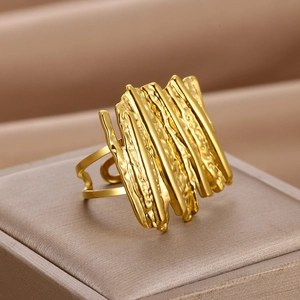 Irregular geometric gold ring with vertical molten texture in an open adjustable design