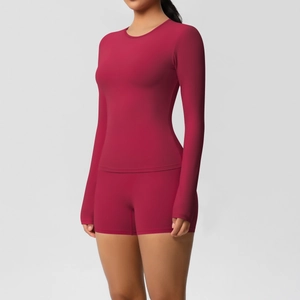 Macro detail of dark red brushed yoga set featuring high-stretch fabric and seamless seams