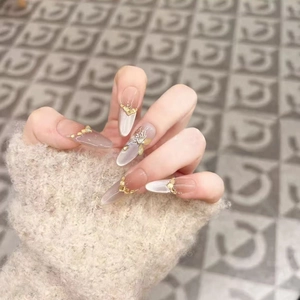 Luxury long almond cat-eye press-on nails with 3D gold butterfly and pearl charms