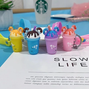 Detail of sweet beverage cup keychains with heart textures and colorful donut ears