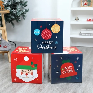 Christmas gift boxes with Santa and snowman patterns for festive holiday decorations