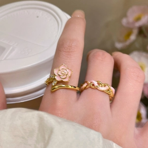 Close-up of 18k gold plated enamel flower ring with zircons on model hand
