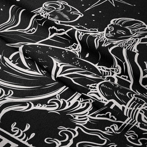 Detail of bohemian tapestry fabric showing twill texture and artistic wave prints