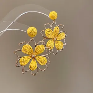Elegant yellow raffia flower earrings with golden metal frame for women summer vacation