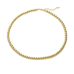 Elegant gold bead necklace with adjustable extension chain on white background