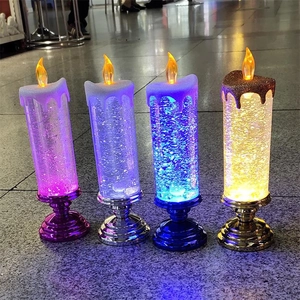 Close-up of vibrant LED liquid glitter candles with colorful lights and metallic bases