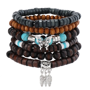 Detail of multi-layer beaded bracelet with dreamcatcher and butterfly charms