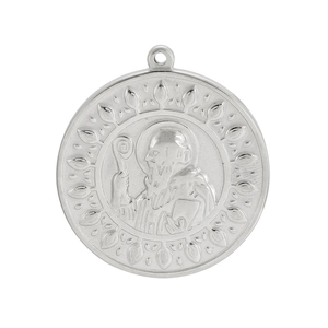 Macro shot of silver exorcist pendant with embossed figure and cross details on white background