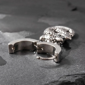 Mens stainless steel hinged hoop earring featuring a detailed dragon head charm pendant