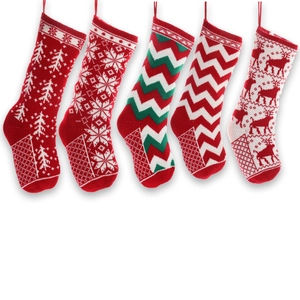 Set of five knitted Christmas stockings with snowflake and reindeer patterns on white background