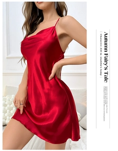 Detailed view of red satin nightgown featuring slim straps and a glossy silk-like finish