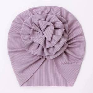 Detail of light purple ribbed knit baby turban hat featuring a large 3D fabric flower