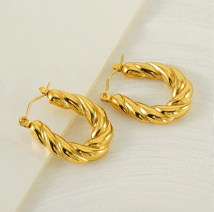 Macro shot of 18k gold plated stainless steel twisted rope hoop earrings with lever-back