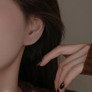 Elegant S925 sterling silver star stud earrings with zircon stones on female model