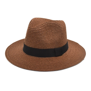 Classic brown straw Panama hat with black grosgrain ribbon for summer beach sun protection
